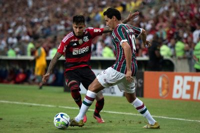 a couple of men playing a game of soccer