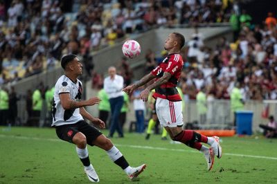 a couple of men playing a game of soccer