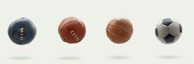a group of four different types of balls