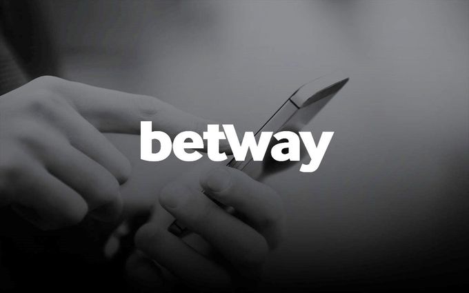 a person holding a cell phone with the words betway on it