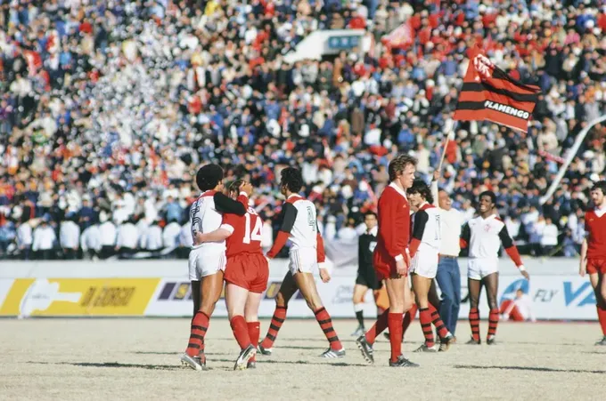 a group of women's soccer players walking across a field