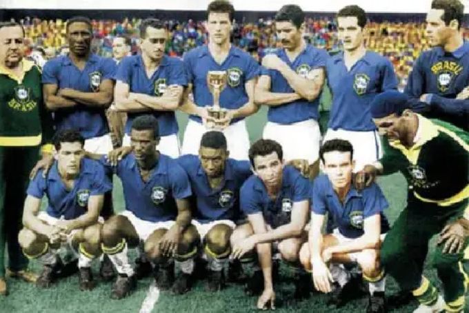 a group of soccer players pose for a team photo