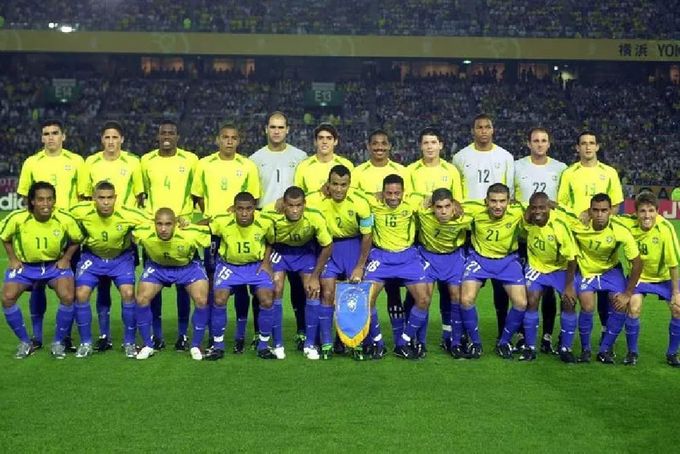 a group of soccer players pose for a team photo