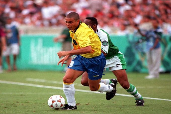 a couple of men playing a game of soccer