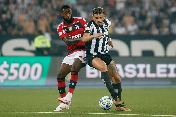 a couple of men playing a game of soccer