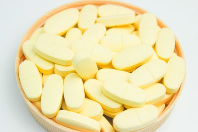 Bowl of long yellow pills