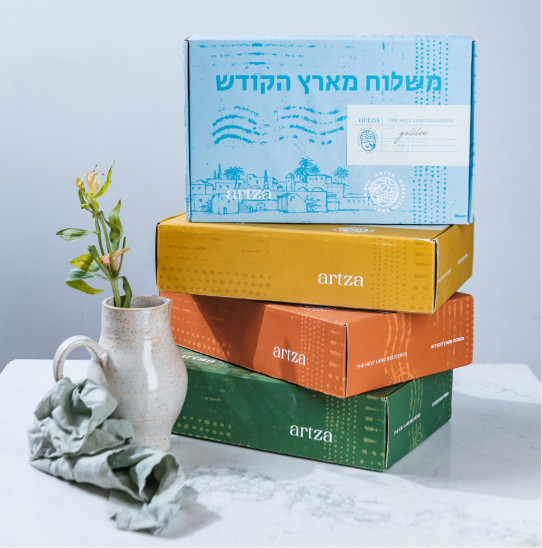 a stack of books sitting next to a vase with a flower in it