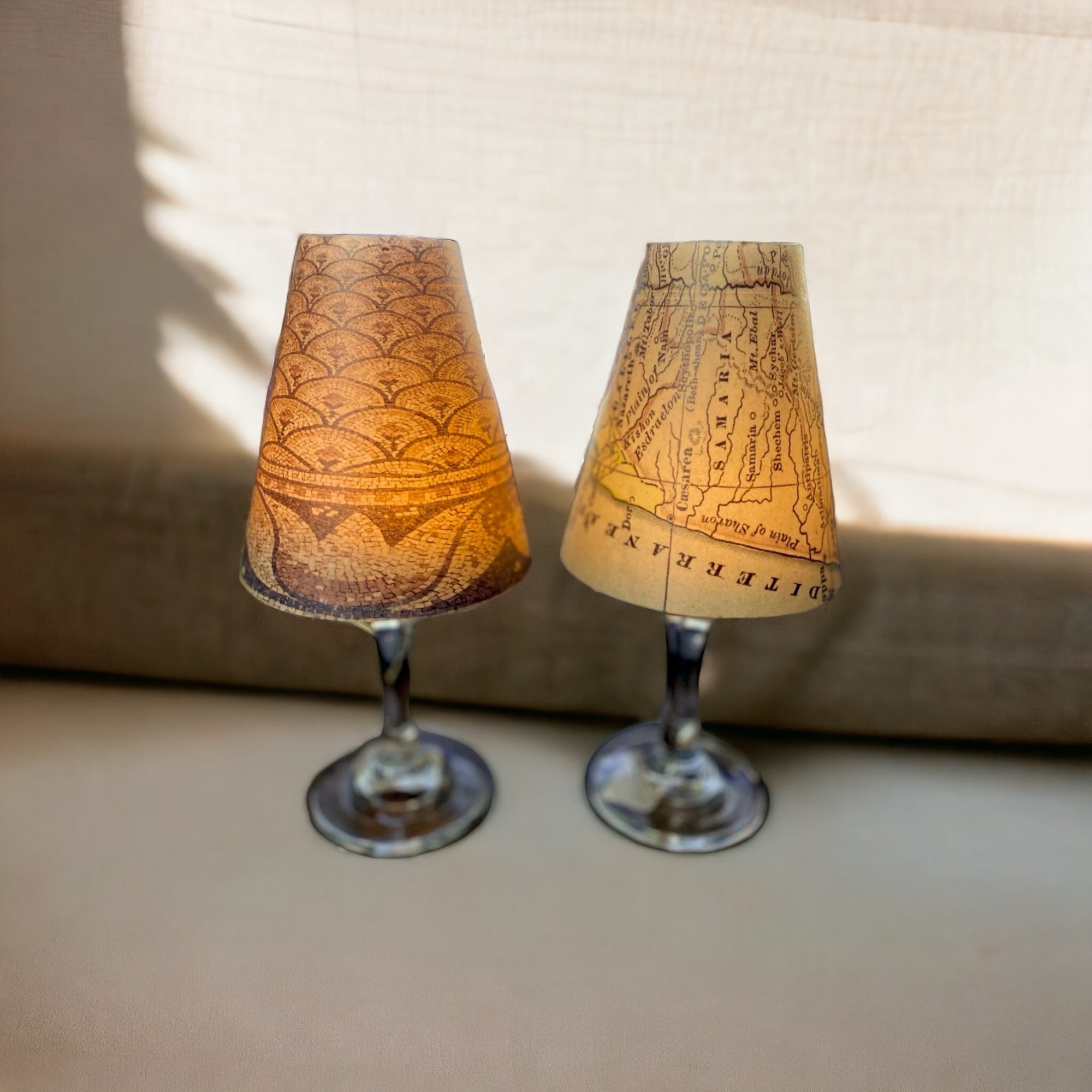 a couple of lamps sitting on top of a table