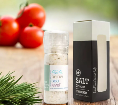 a bottle of salt next to a box of pepper