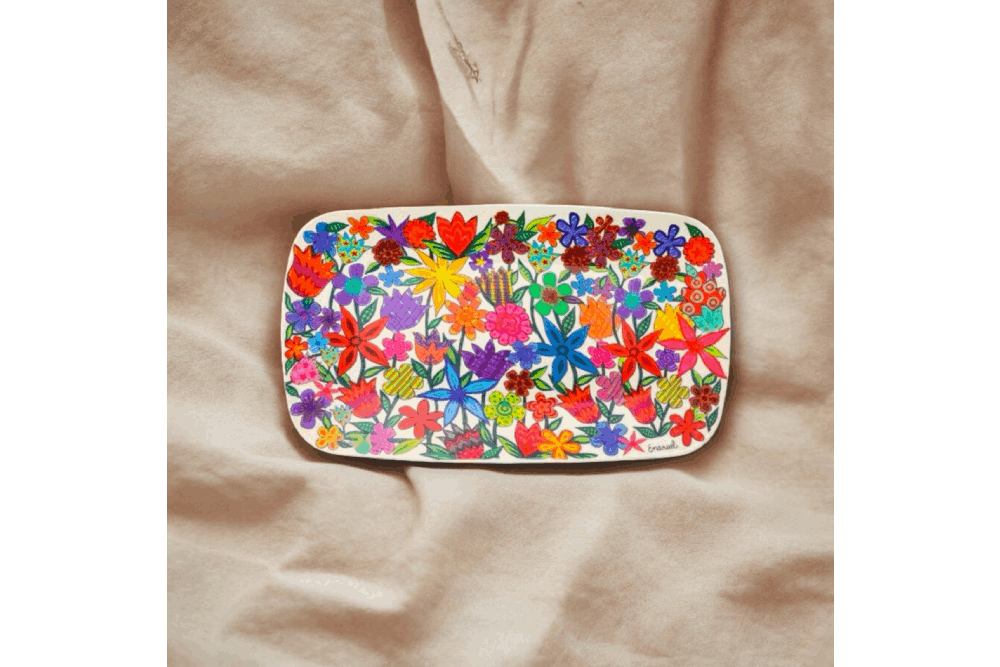 a plate with a colorful flower design on it