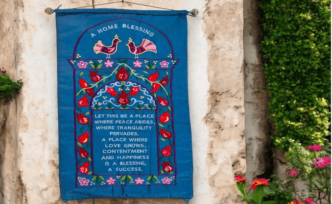 a blue banner hanging on the side of a building