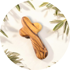 a wooden dog bone on a white plate