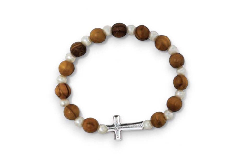 a beaded bracelet with a cross charm