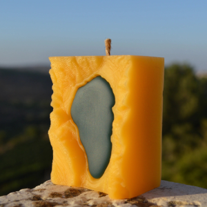 a piece of cheese sitting on top of a rock