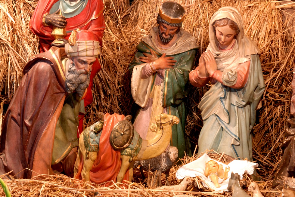 Three wise men in the nativity scene with baby Jesus