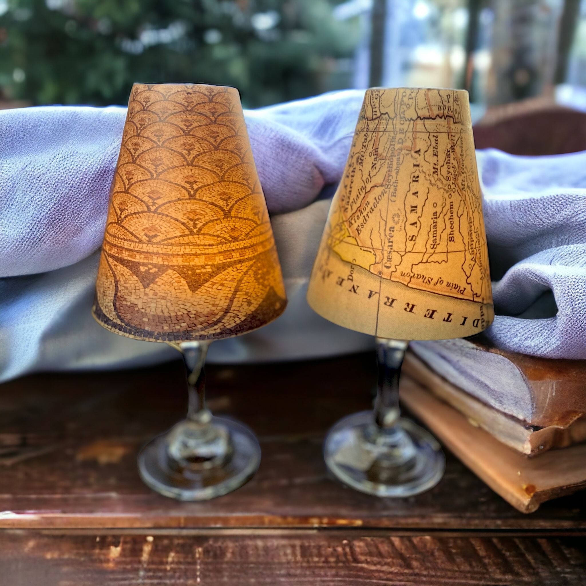 a couple of lamps sitting on top of a wooden table