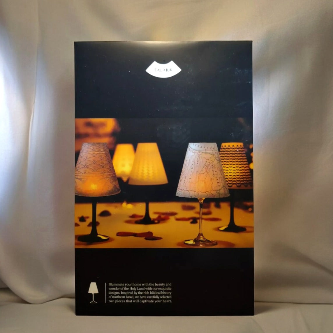 a book with a lamp on top of it