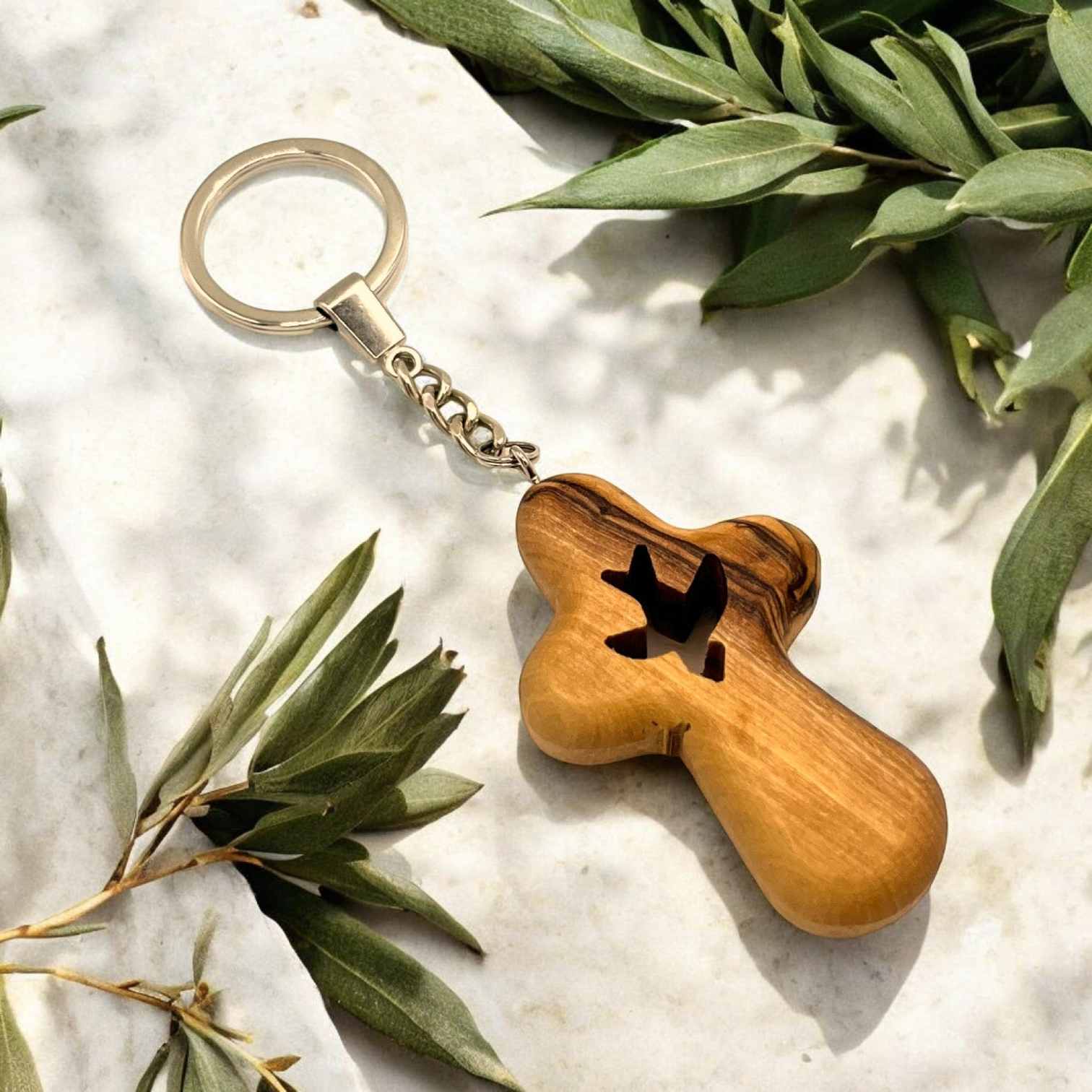 a wooden keychain with a dog bone on it