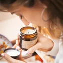 a woman holding a candle in her hands