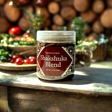 a jar of food sitting on top of a wooden table
