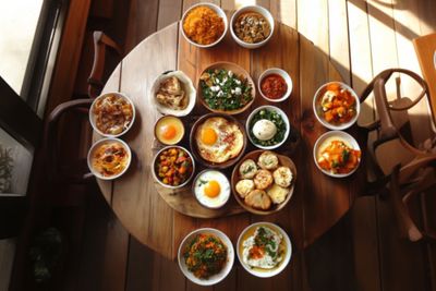 A table filled with bowls of traditional Israeli food.