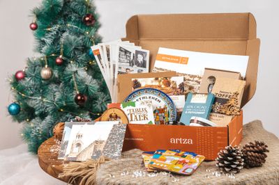 Subscription box next to decorate Christmas tree with artisanal products