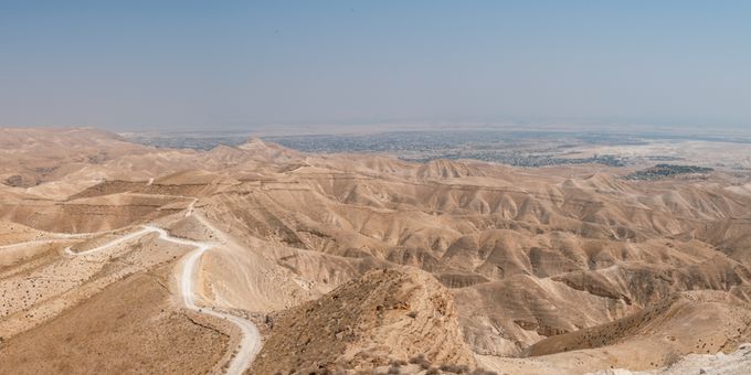 Jericho Israel Holy Land an aerial view of a mountain range with a winding road in the foreground