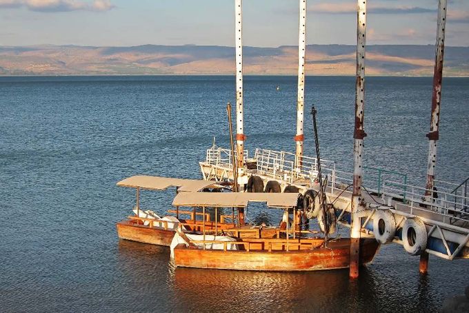 A large boat floating on top of a large body of water.