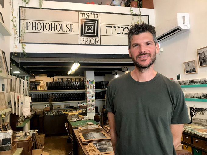 Ben standing in front of a store in Israel the photohouse 
