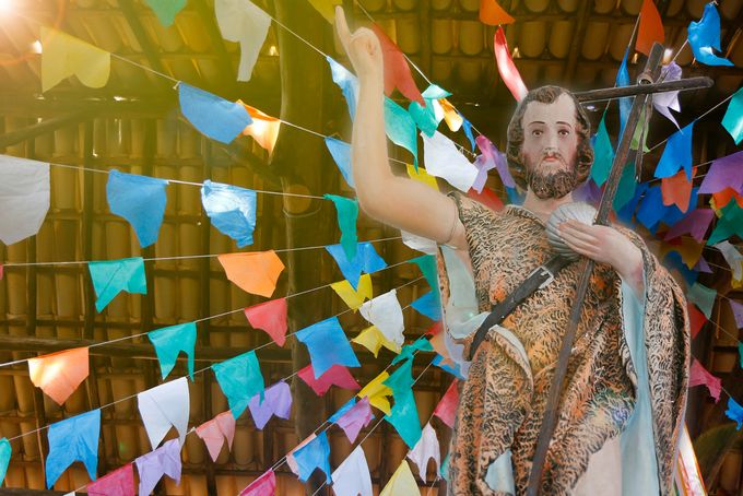 Marble Statue of John the Baptist surrounded by bunting
