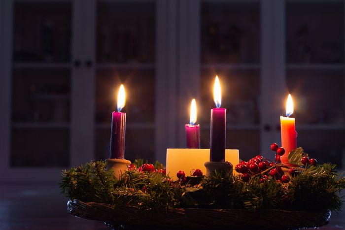 a basket filled with candles sitting on top of a table