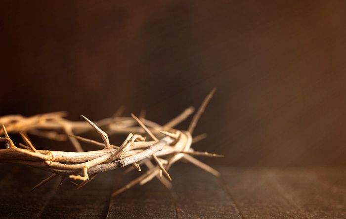 a crown of thorns on a wooden table