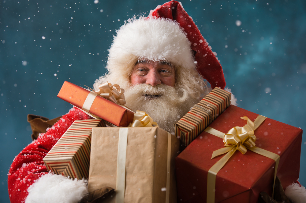  Santa Claus holding Christmas gifts