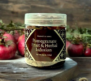 a jar of pomegranate fruit and herb infusion