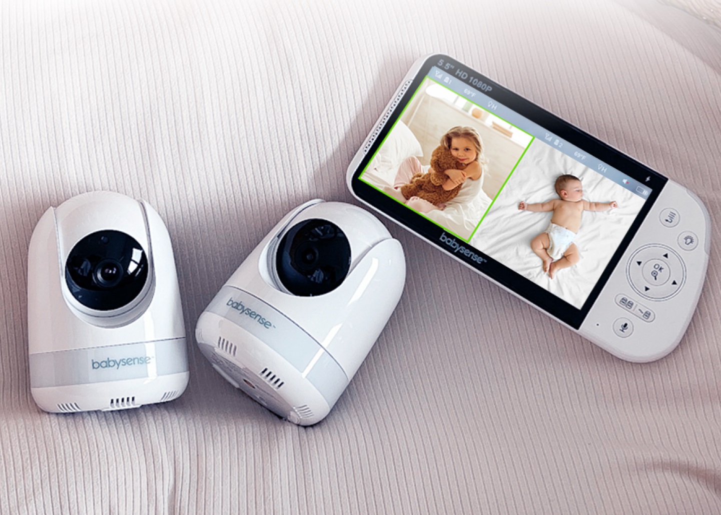 a baby monitor and a camera on a bed