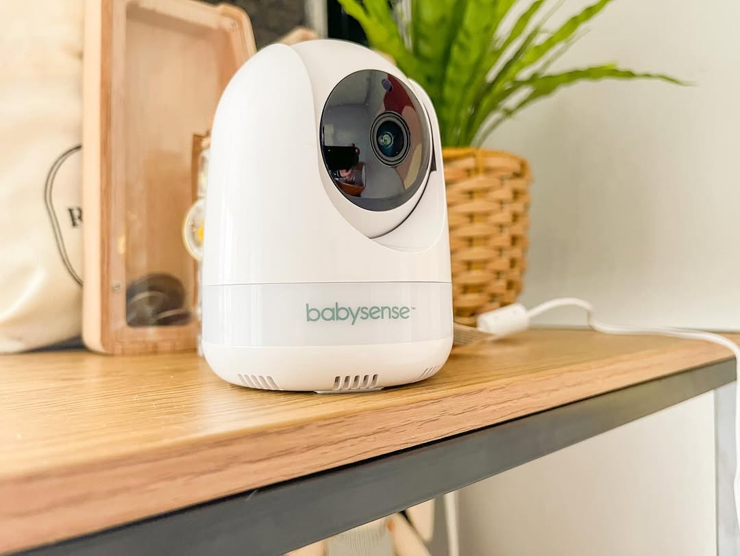 a baby monitor sitting on top of a wooden table