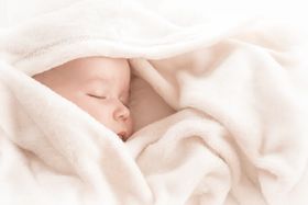 When Can Your Baby Sleep with a Blanket?