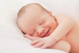 Why Do Babies Smile in Their Sleep?