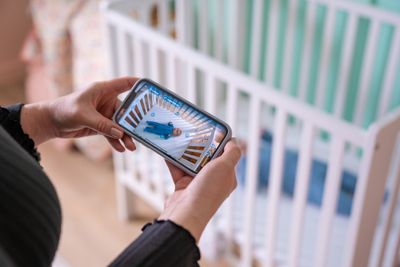 A mother using a Babysense monitor.