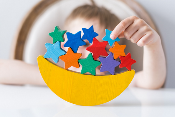 A child's balancing game with colorful stars