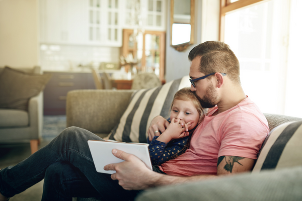 Father and daughter on couch