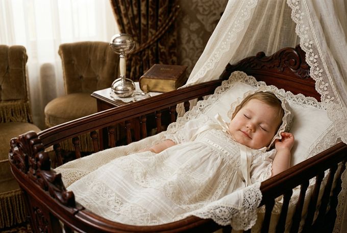 a baby is laying in a crib in a room