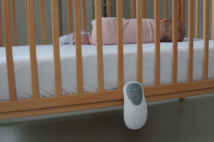 A monitor on a baby crib.