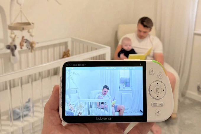 A father getting his baby ready for sleep.