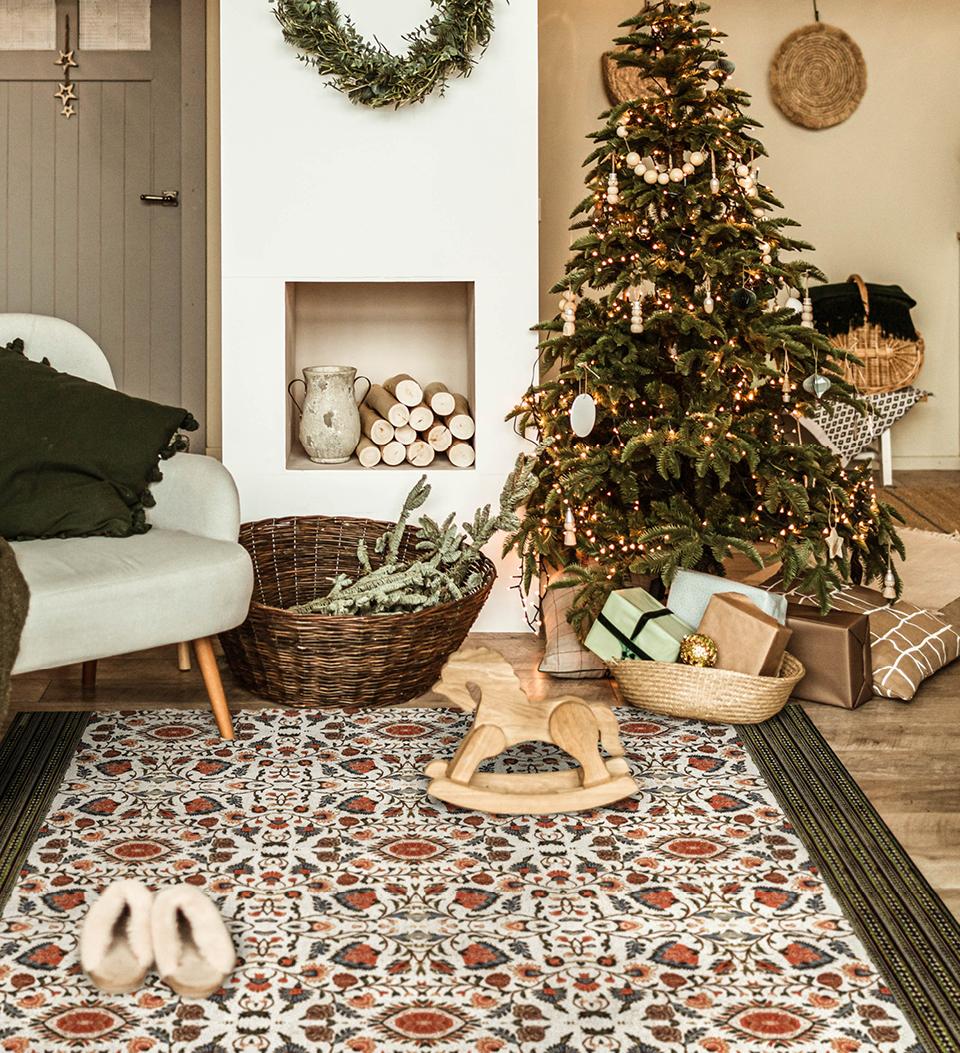 Bohemian-style patterned rug on the floor of a living room decorated for Christmas
