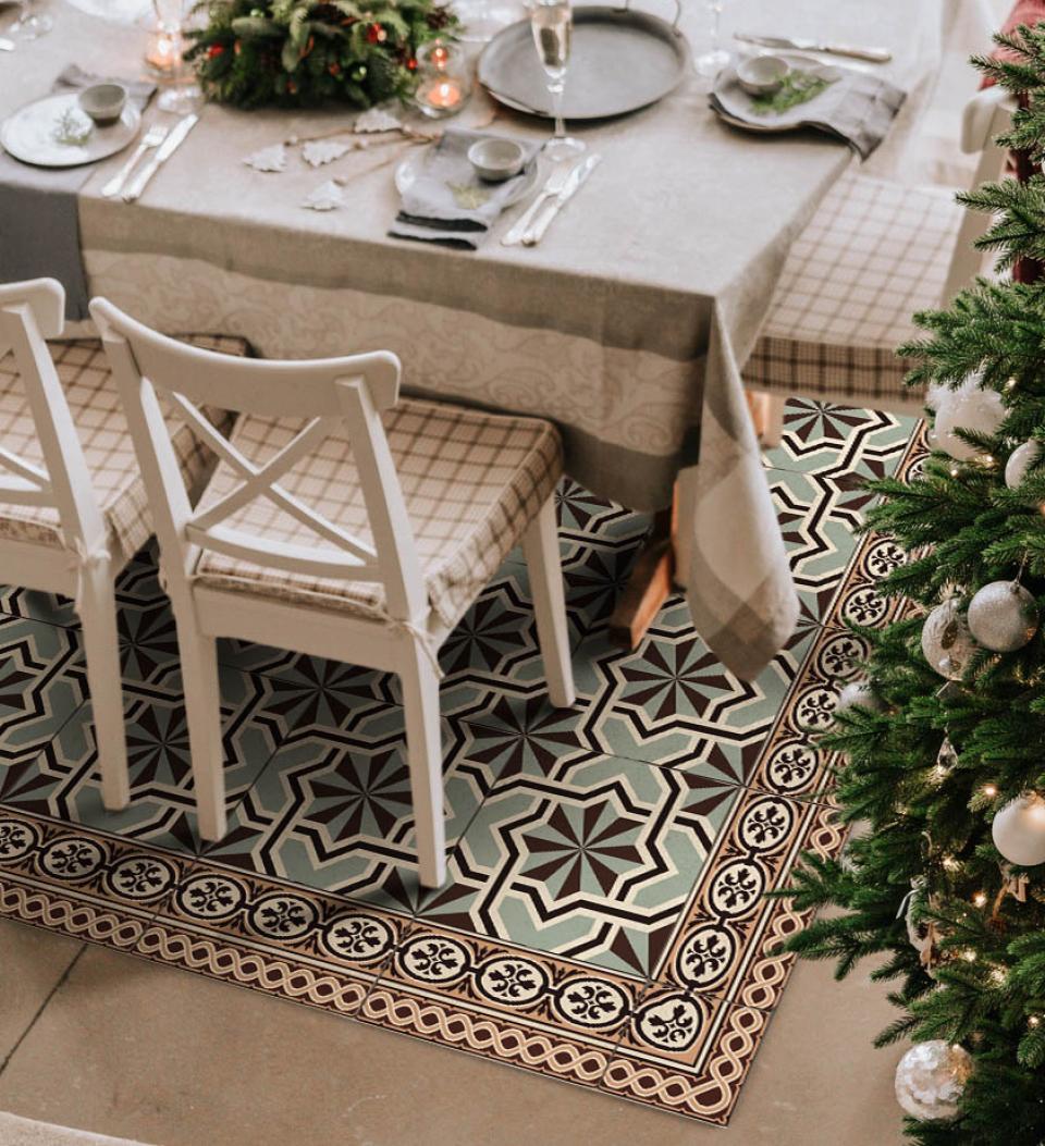 Snow-patterned rug under a dinner table decorated for Christmas