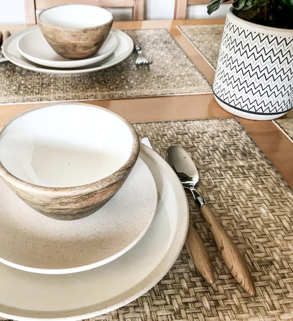 A rattan cross patterned placemat under a dining room tea set 