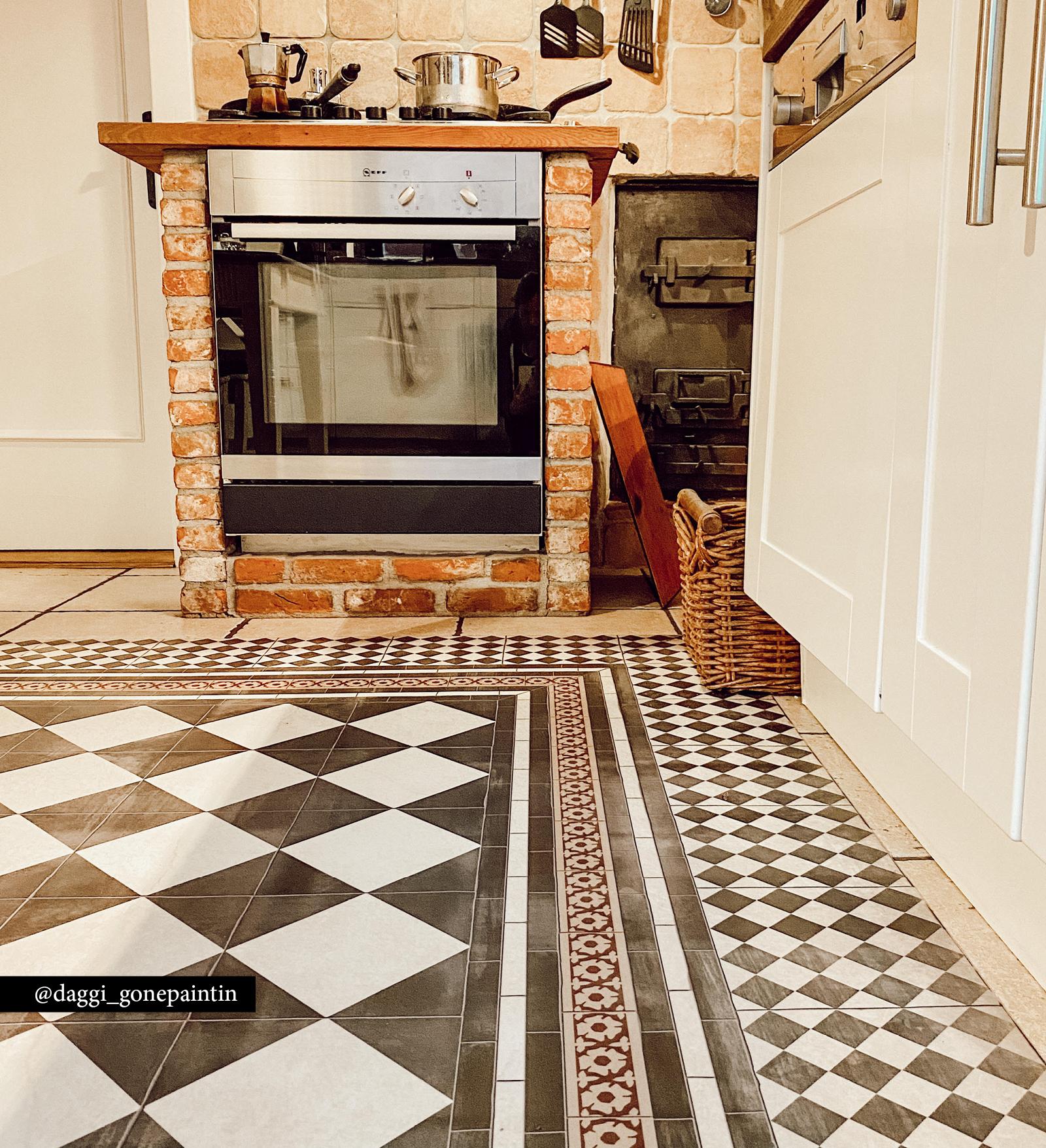  black and white chess board patterned rug placed next to stove 