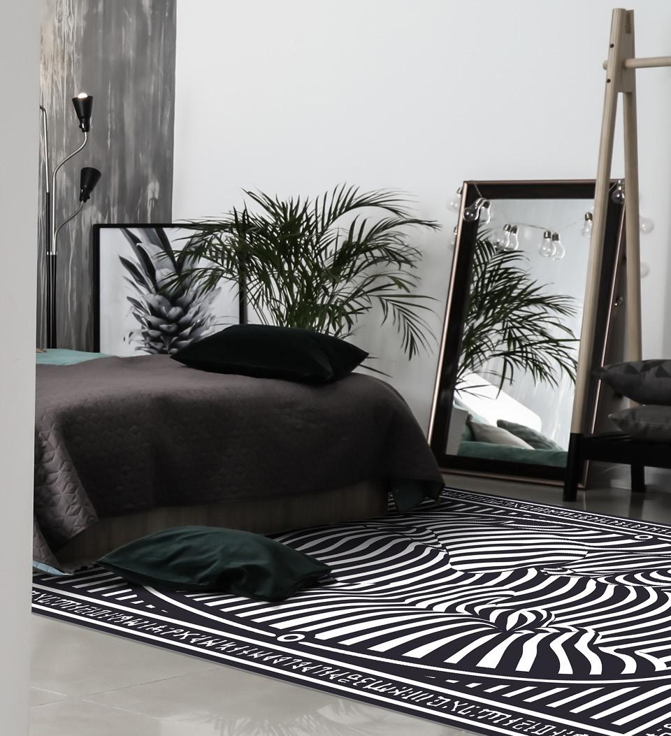 Zebra-patterned rug on a bedroom floor in front of the bed