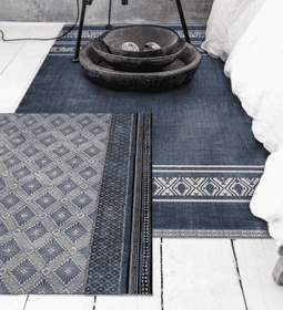 How to Skillfully Layer Rugs in Any Bedroom